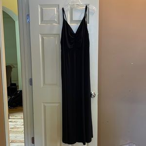 Formal length black jersey gown with double straps and front slit